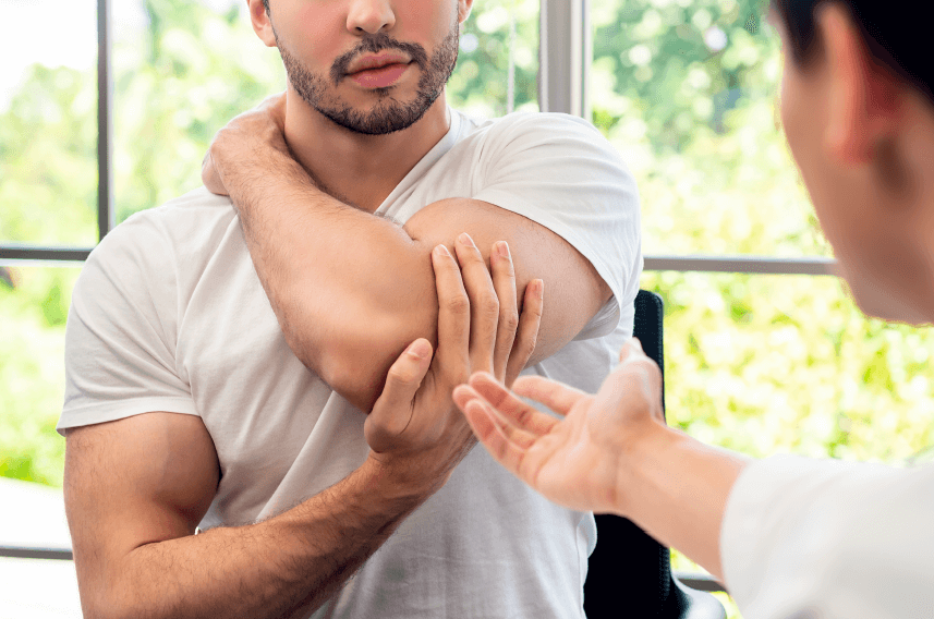 doctor helping patient with PRP shoulder therapy 