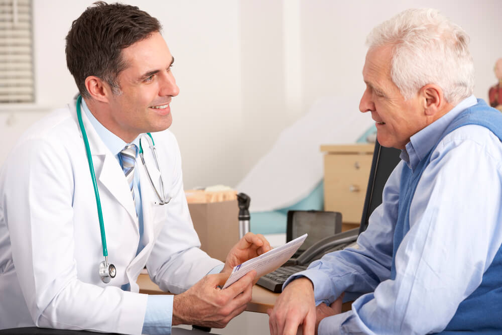 Doctor with male patient during his Free Immune Consultations